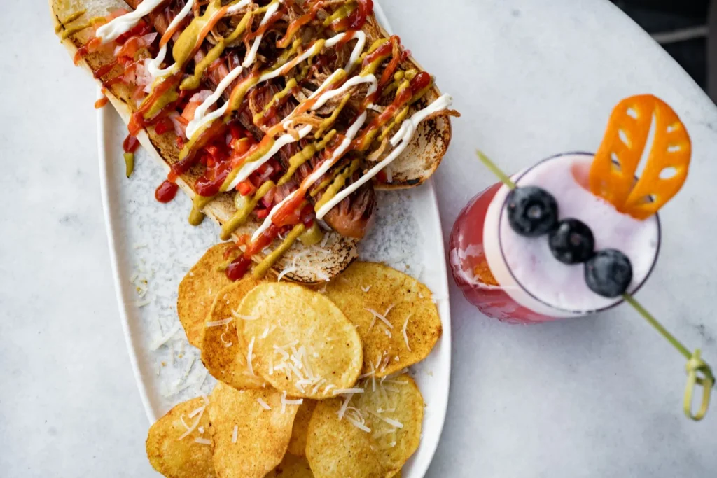 Sandwich with chips and drink - illustrative stock photo